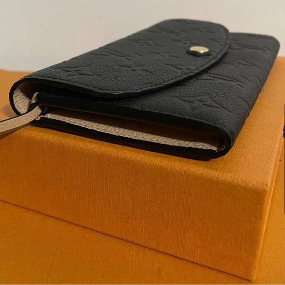 Authentic Louis Vuitton Emilie Monogram Empreinte Leather Wallet in black - Picture 7 of 9